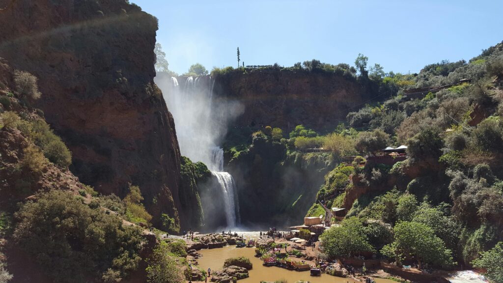 Scenic view of Ouzoud Waterfalls surrounded by lush greenery in Morocco.