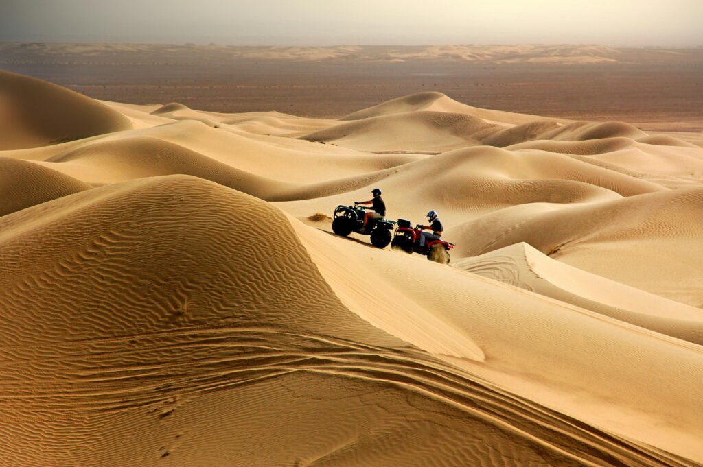 Experience thrilling quad biking across Merzouga's stunning desert dunes.