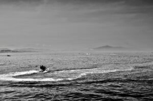 Black and white image of a speedboat gliding across the Mediterranean Sea near Tétouan, Morocco.