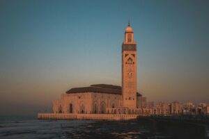 Stunning view of Hassan II Mosque against the sunset sky in Casablanca, Morocco.