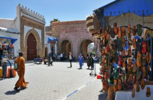 Explore the bustling street market of Essaouira, Morocco with local crafts and vendors.