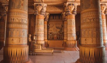 Intricate Egyptian-themed columns inside a temple-like structure in Ouarzazate, Morocco.